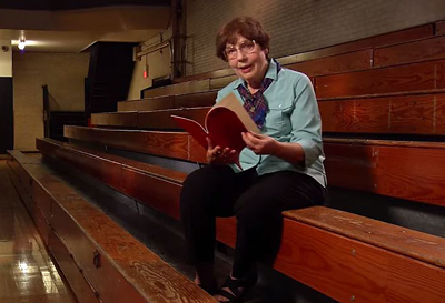 Sister Mary reminisces over a playbill from her teaching days.